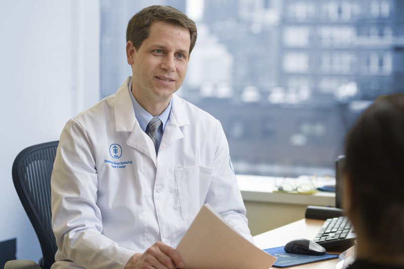 William Tap, Chief of MSK’s Sarcoma Medical Oncology Service, sits at his desk 