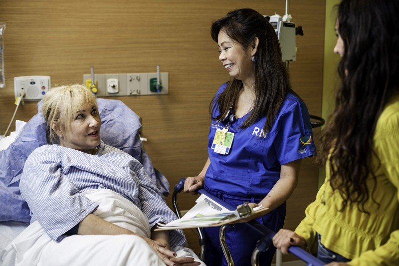 Raquel Bullard, a nurse in the post-anesthesia care unit (PACU) tends to a patient after a procedure at the David H. Koch Center for Cancer Care. 