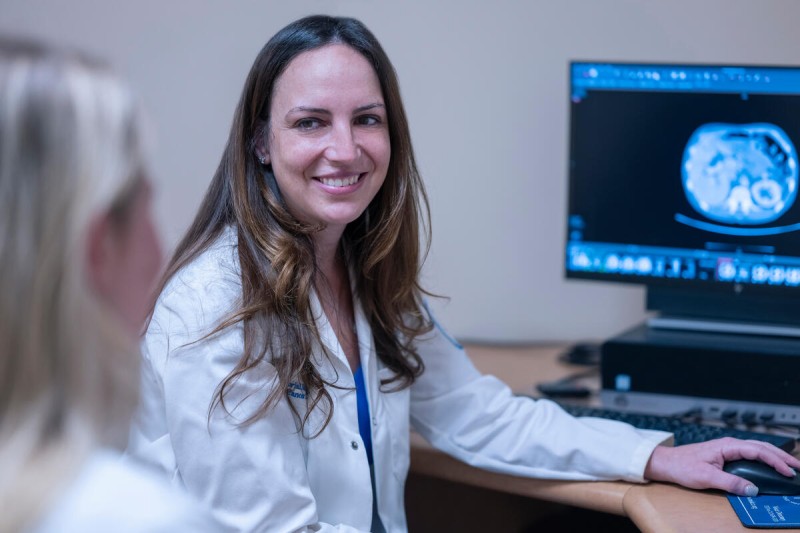 MSK gastroenterologist Robin Mendelsohn seen smiling at desk. 