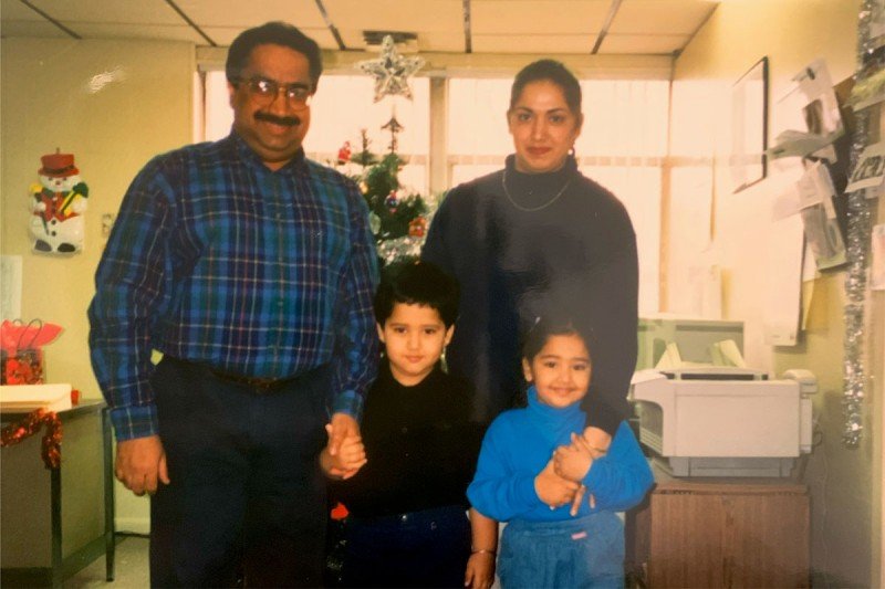 Vik with his sister, mom and dad