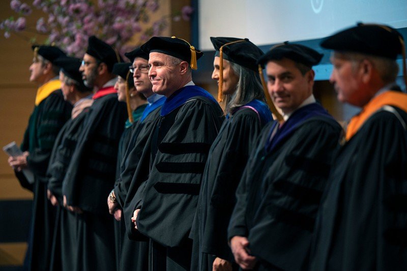 Line of people in caps and gowns