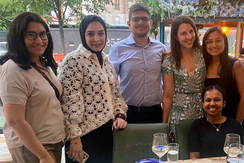 Five Infectious Disease fellows with a faculty member at fellowship graduation dinner.