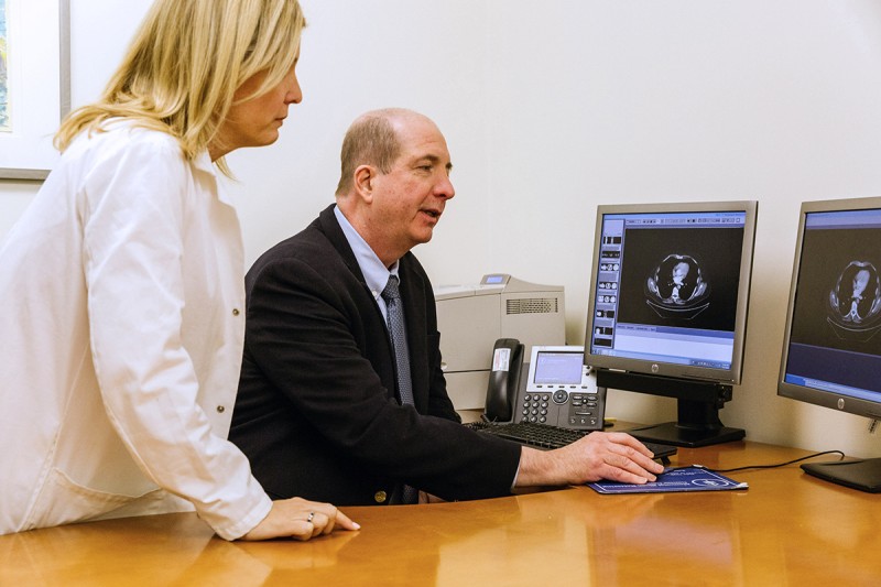 Dr. Motzer reviewing radiology images with nurse.