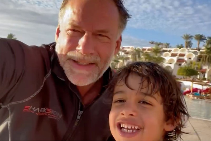 Man and son selfie outdoors.