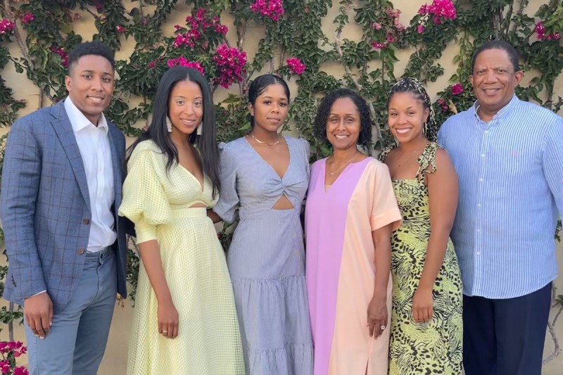 Dr. Selwyn Vickers seen outdoors with his wife, Janice, and their four children. 