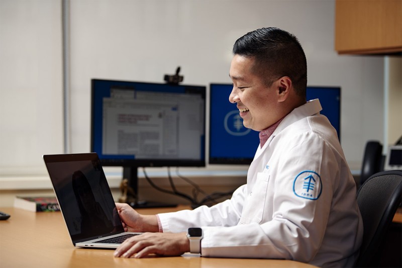 Dr. Alexander Drilon speaking with a patient over telemedicine