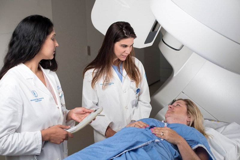 Two doctors looking at a patient