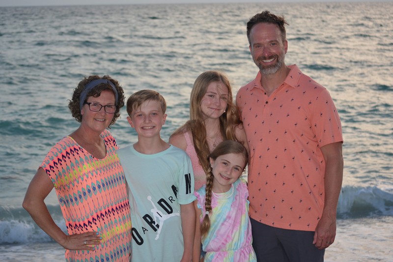 MSK breast cancer patient Majiel Baker is seen at the beach with her husband and children. 