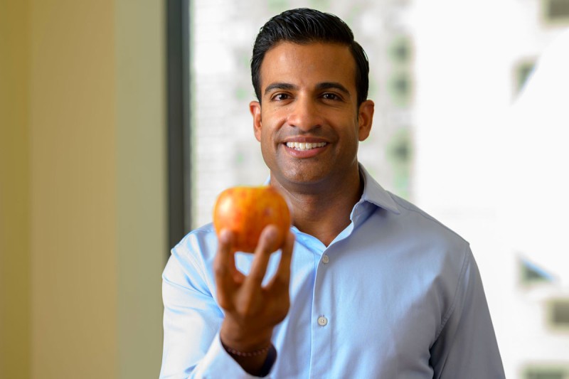 Neil Iyengar, medical oncologist at Memorial Sloan Kettering, is seen holding a piece of fruit. 