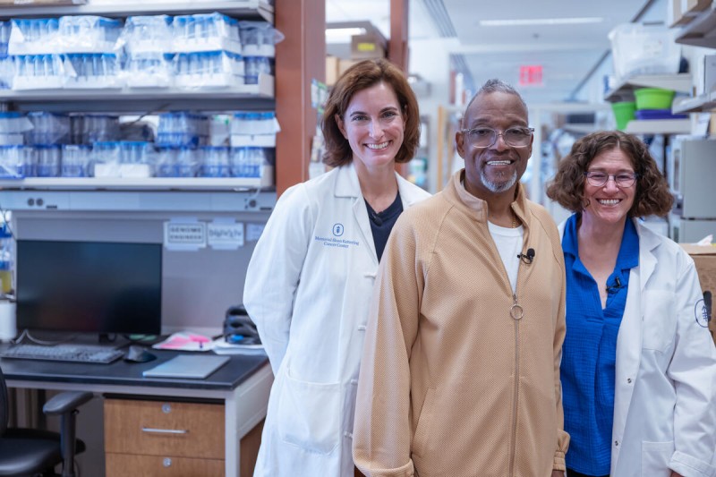 MSK neuro-oncologist Adrienne Boire and computational biologist Dana Pe’er with a male patient in a laboratory.