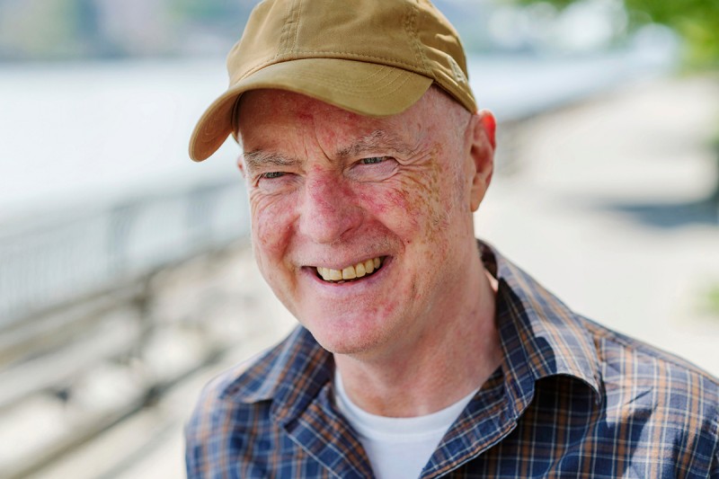 James Mangan seen smiling near a river. 