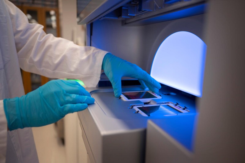 Lab member using a next-generation sequencing machine