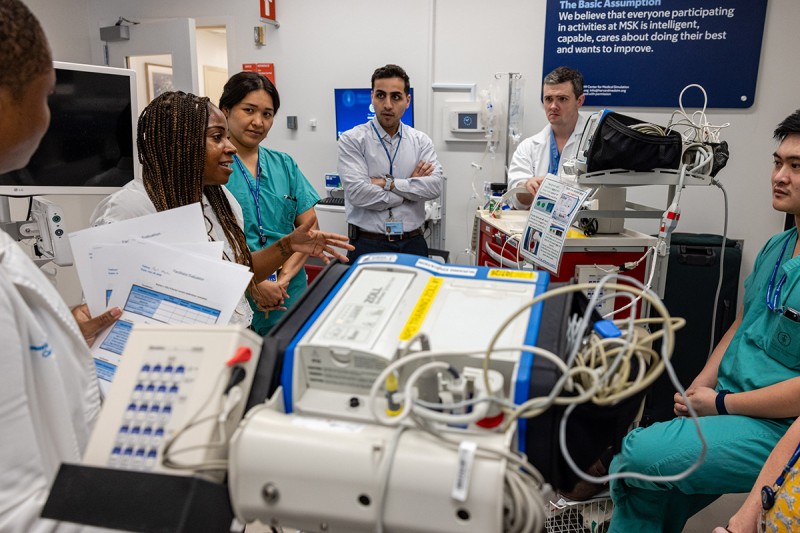 Assistant nurse leader and nursing staff participating in a simulation at the annual CPR workshop.