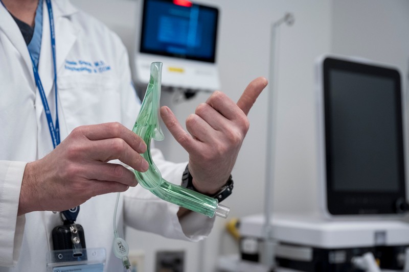 Hand holding an adjunctive airway at the airway workshop.