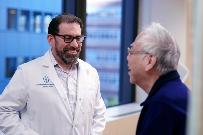 Luis Alberto Diaz Jr., MD with a patient