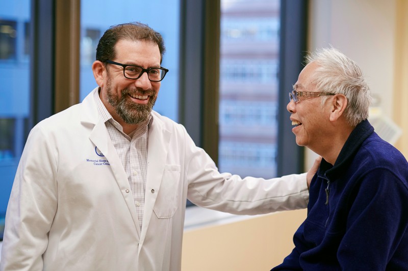 MSK gastrointestinal oncologist Luis Diaz Jr with male patient.