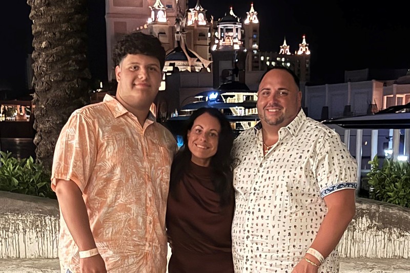 MSK patient Joanne Ferrari-Mautino seen outdoors with her son and boyfriend. 