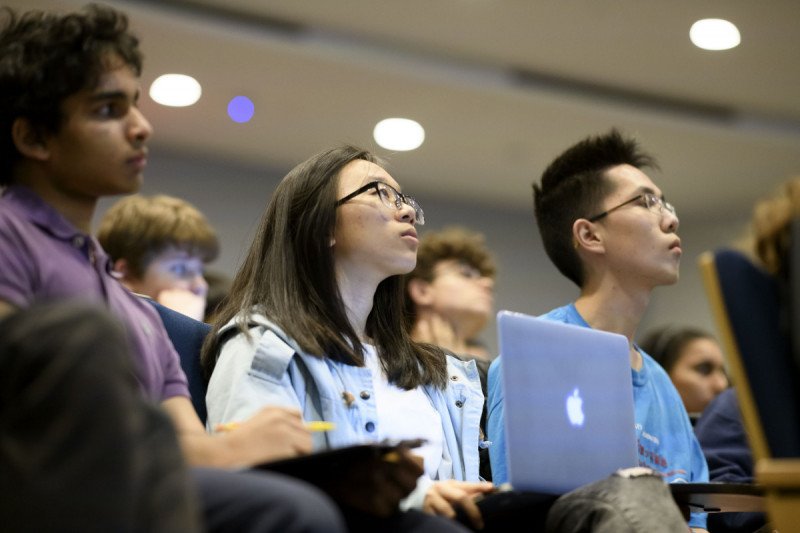 Students listening to presenters.