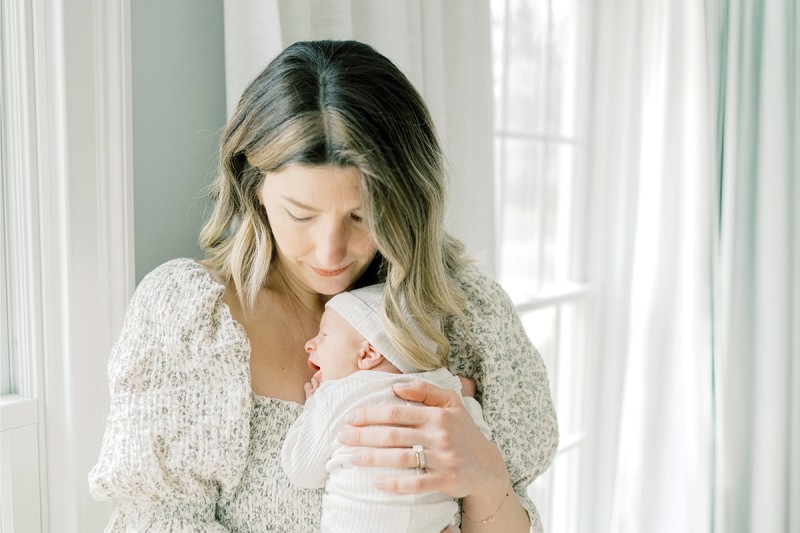 Mother holding her newborn baby.