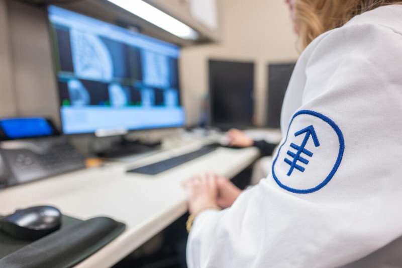 An MSK researcher reviews images on a screen