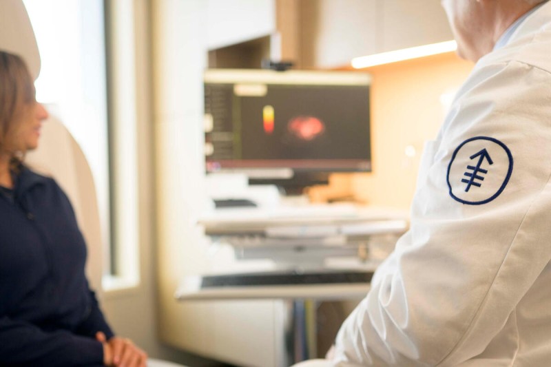 a doctor and patient review a scan