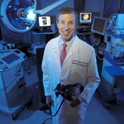David Abramson is shown surrounded by the state-of-the-art technology he uses to treat children with retinoblastoma.