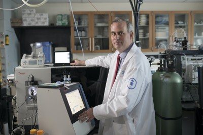 Pathologist Michael Roehrl working in lab