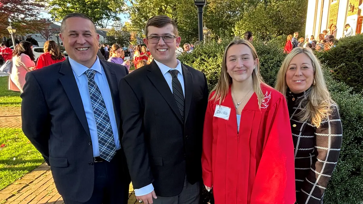 Jon Desjardins, who had immunotherapy at MSK after colorectal cancer surgery, is with family at a graduation ceremony.