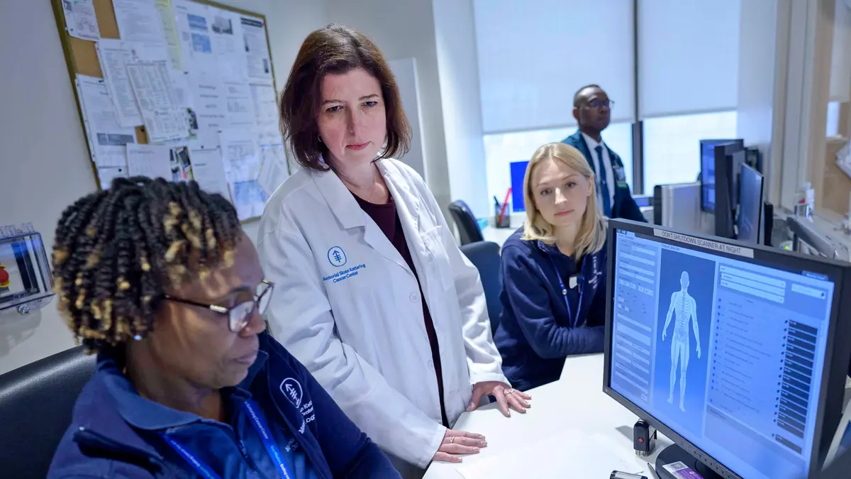 Radiologist Dr. Viktoriya Paroder and MSK colleagues review radiology scans on a computer.