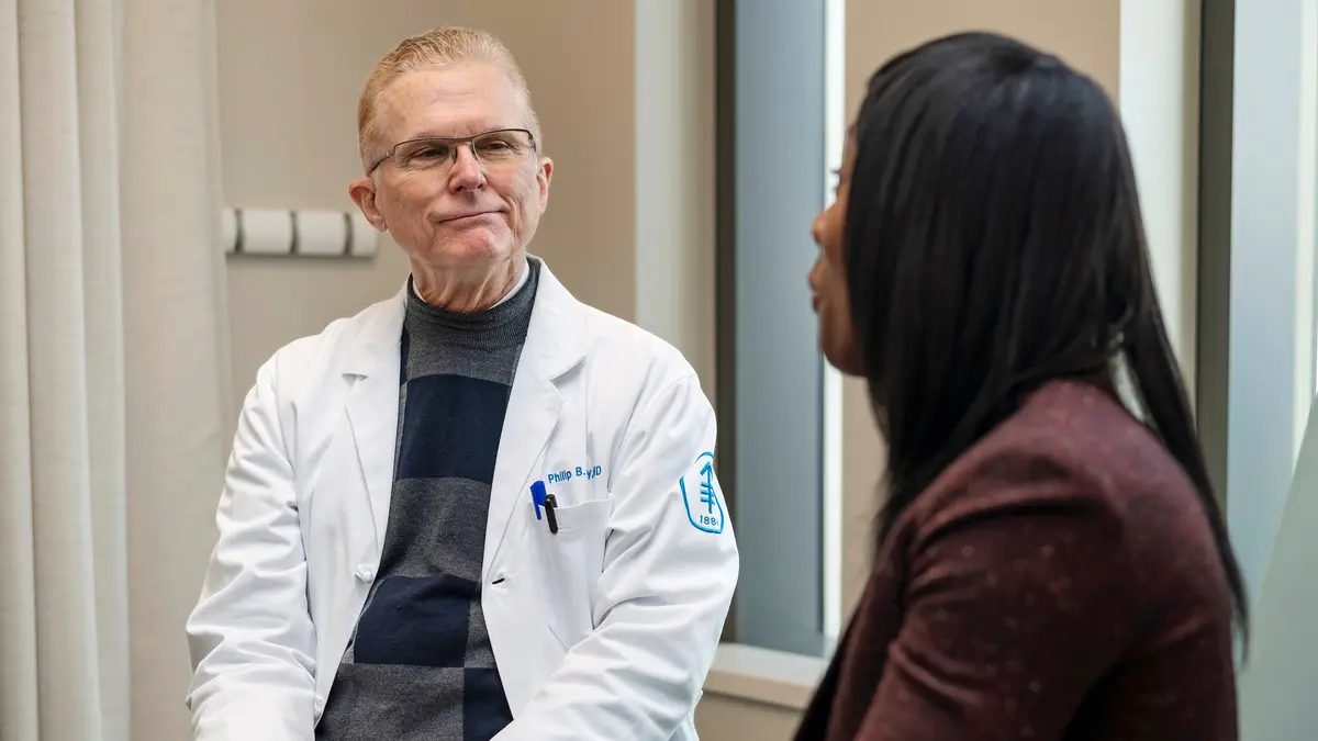 Colorectal surgeon Dr. Philip Paty in New York City is talking with his MSK colorectal cancer patient. 
