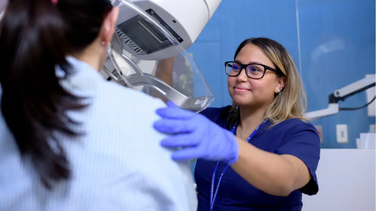 MSK expert administering mammogram