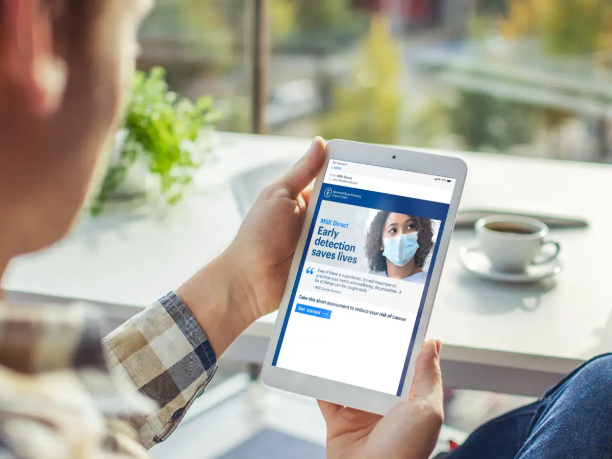 A man reading a tablet
