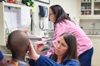 A child has his eyes examined by an ophthalmic oncologist.