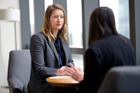 Angela Katrichis speaks with a patient