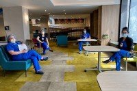 MSK employees enjoying each other’s company, from a distance, in a new relaxation space.