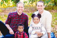 Ben, Kyle, Charles, and Gloria on a picnic blanket