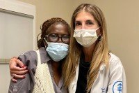 Dr. Yelena Janjigian hugs MSK patient Cecilia Defoe 
