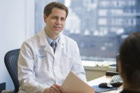 William Tap, Chief of MSK’s Sarcoma Medical Oncology Service, sits at his desk 