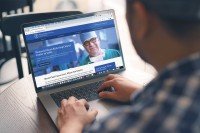 Person looking at MSKCC India website