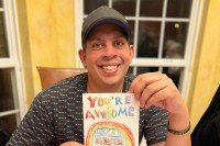 MSK patient Jason Giani holding a Valentine's Day card