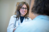 Dr. Shanu Modi speaks with a patient