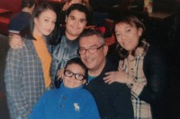 Perry Ortiz surrounded by his wife, daughter, and two sons