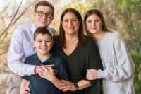 MSK patient Jen Cosgrove is seen smiling with her three children. 