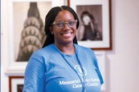 Senior Community Programs Manager Shakima Grant wearing a blue MSK shirt and smiling 