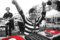 DJ and MSK patient Cynthia Malaran performing joyfully at South Street Seaport 