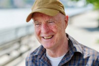 James Mangan seen smiling near a river. 