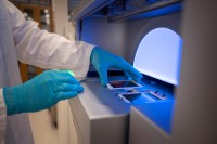 Lab member using a next-generation sequencing machine