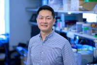 MSK's Wungki Park, MD, seen smiling in laboratory. 