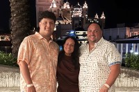 MSK patient Joanne Ferrari-Mautino seen outdoors with her son and boyfriend. 