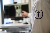 An MSK researcher points at a medical image